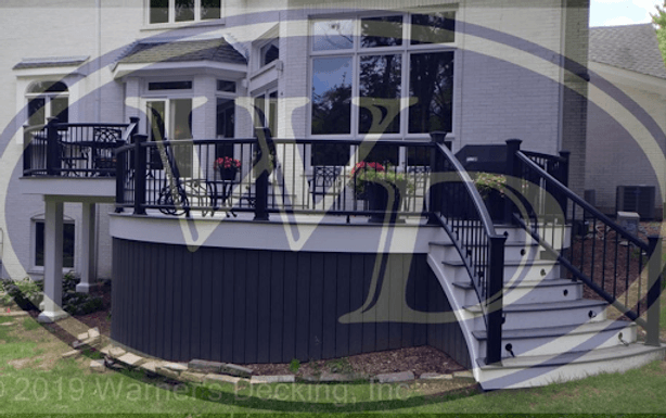 Curved Naperville backyard deck with Trex bending