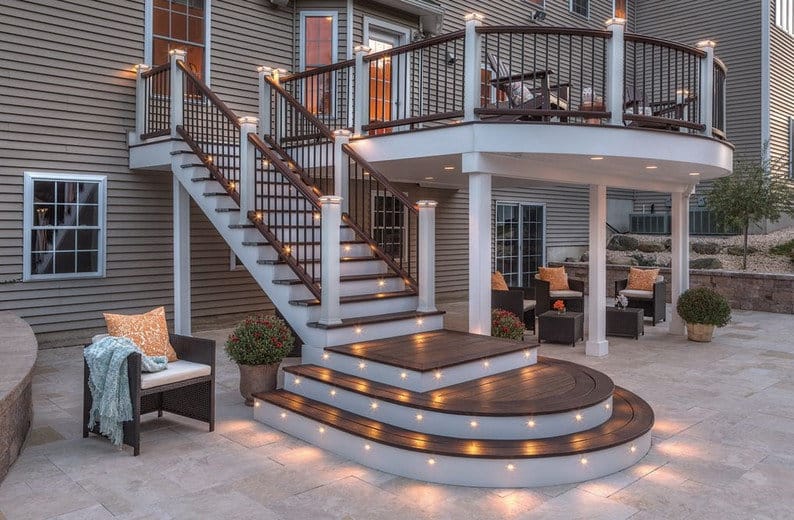Newly built elevated Trex deck in Brown with white fascia and integrated lighting