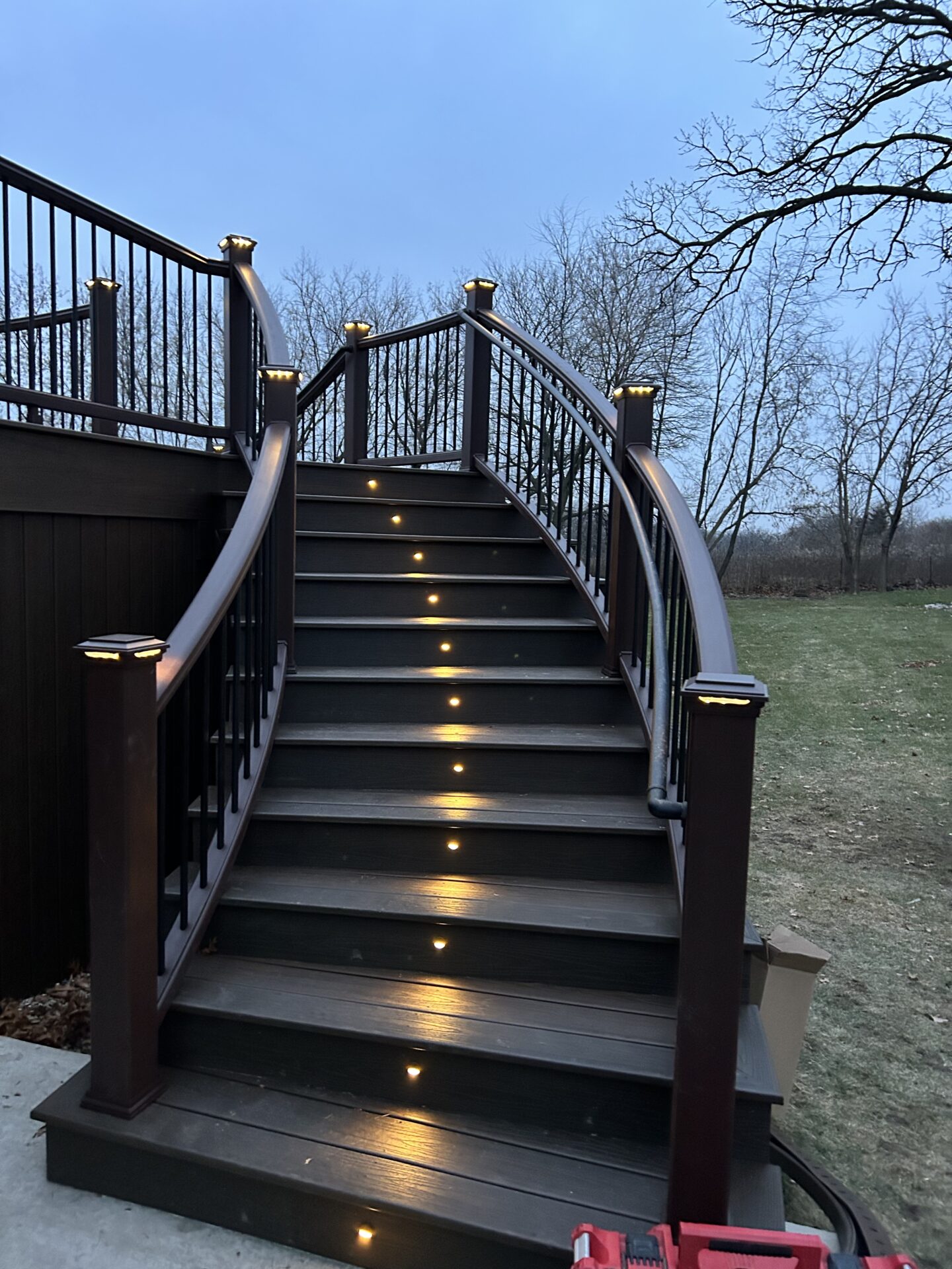 Custom trex deck integrated with stair and rail lighting.