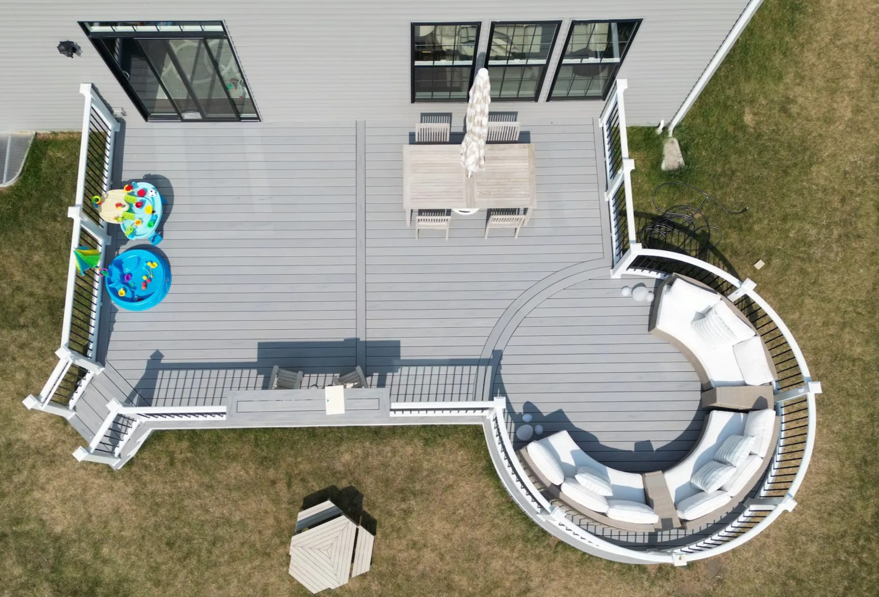 Aerial view of a newly installed Trex composite deck featuring Trex curve decking.