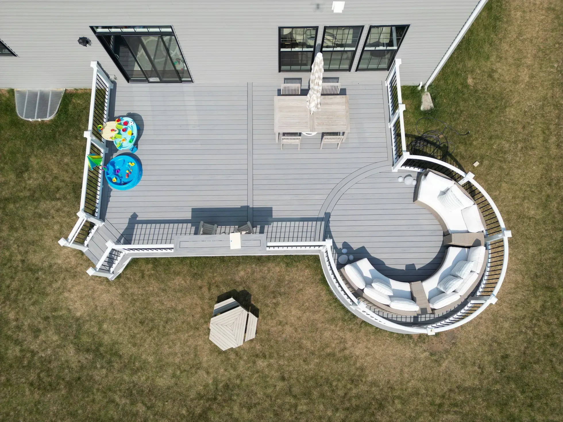 Custom curved composite deck with a seating area.