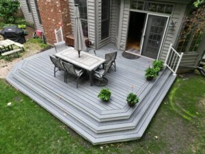 Ground level composite deck with stairs in Naperville