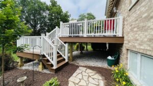 Multi-level Trex composite deck with staircase and connected patio in Naperville, Illinois