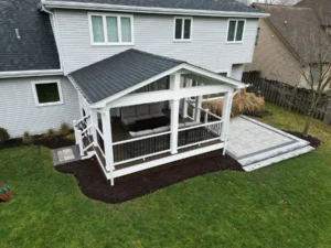 Composite deck with a covered roof in Naperville, IL.