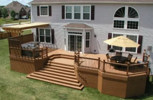Trex Signature® composite deck in Ocracoke color, with a dining area, pergola.