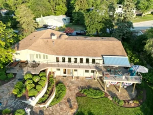 Top-down view of a raised deck with a landscaped patio.