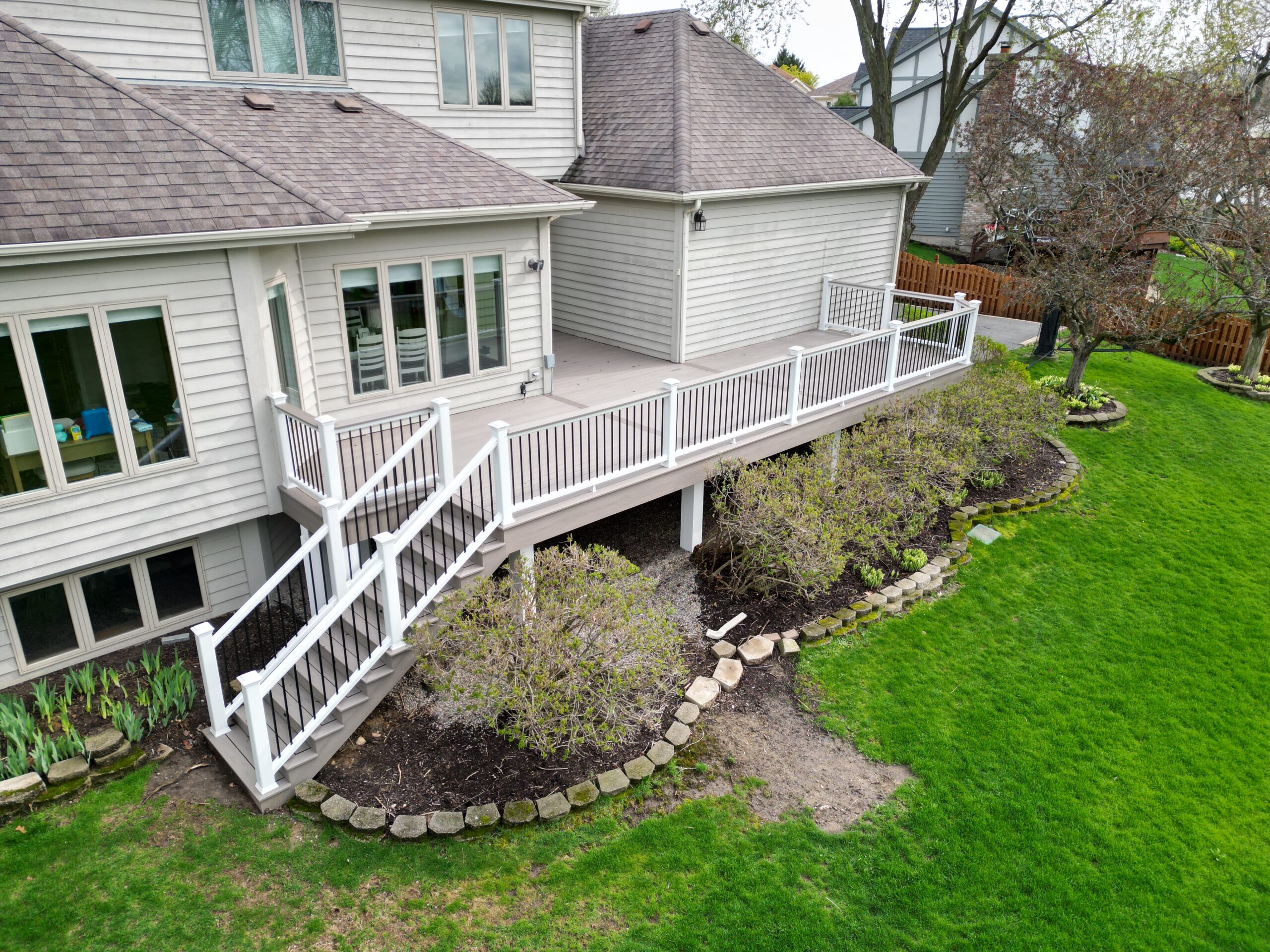 Raised Trex composite deck built by a professional deck contractor - Warner's Decking