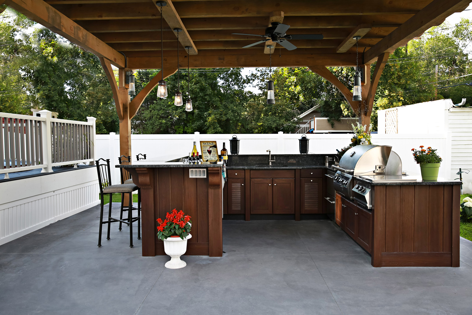 outdoor kitchen covered under a roof structure