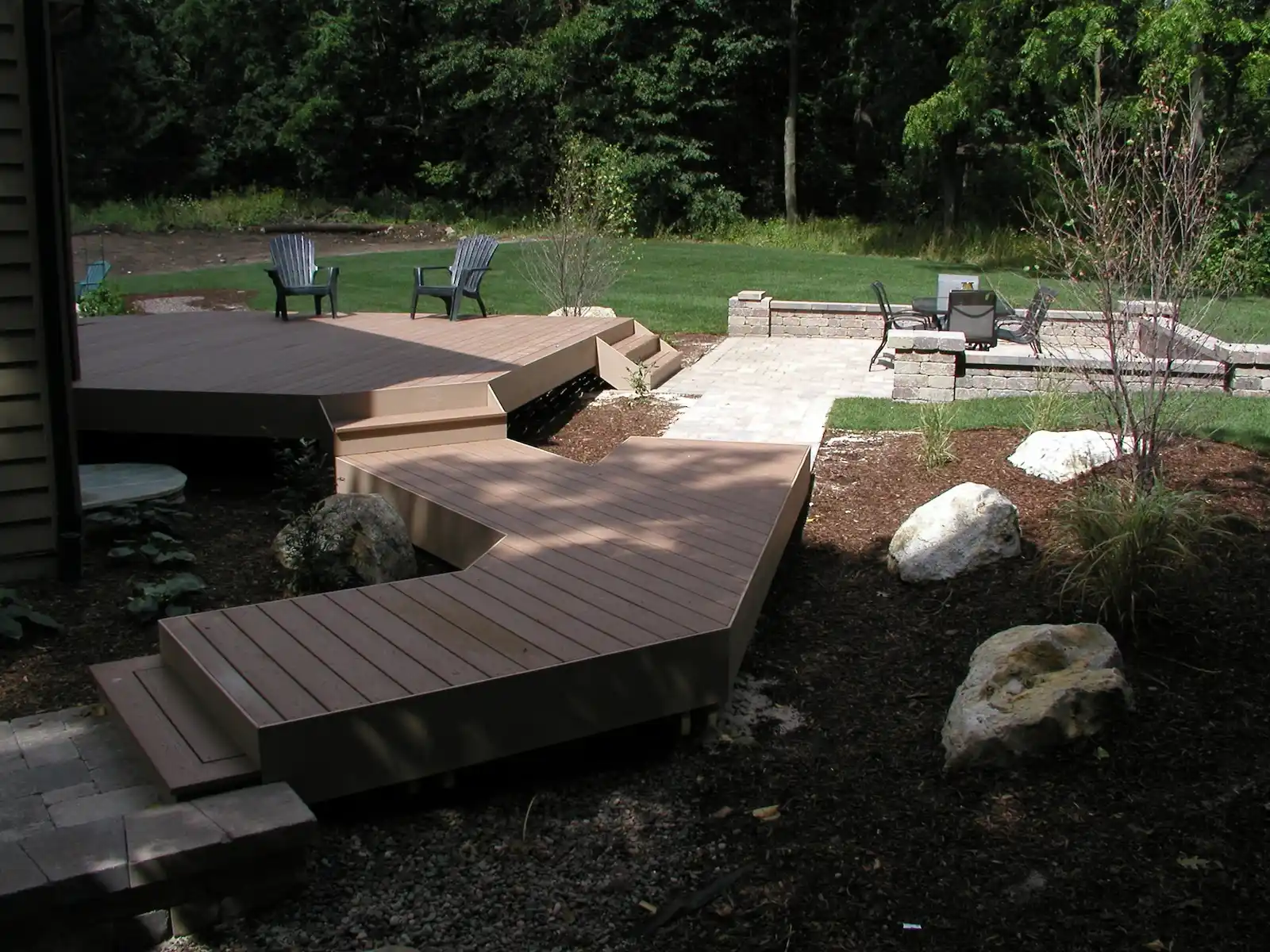 Composite deck to backyard patio transformation