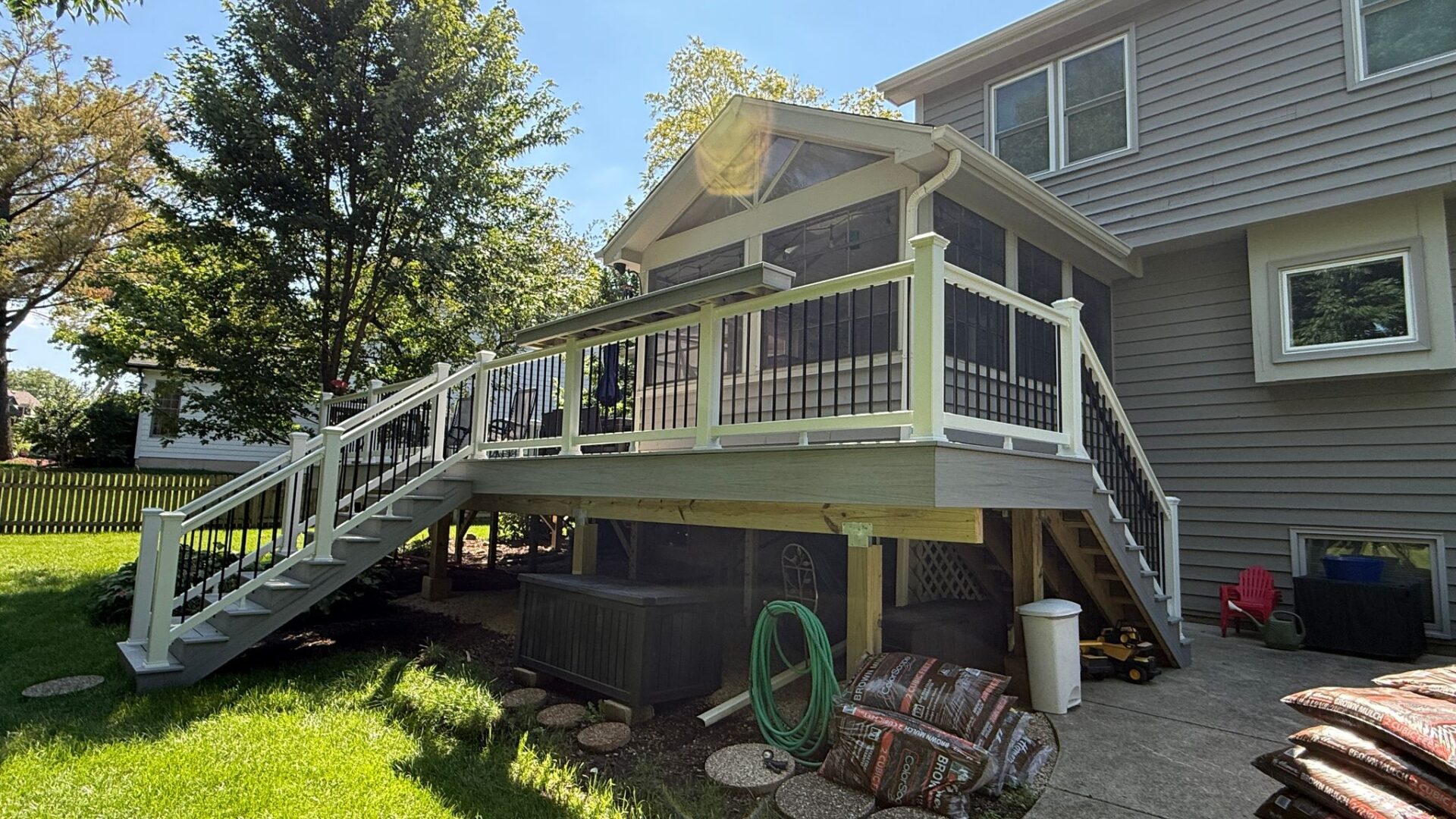 Raised composite deck supported on helical piers built by a Naperville deck contractor Warner's Decking of Naperville