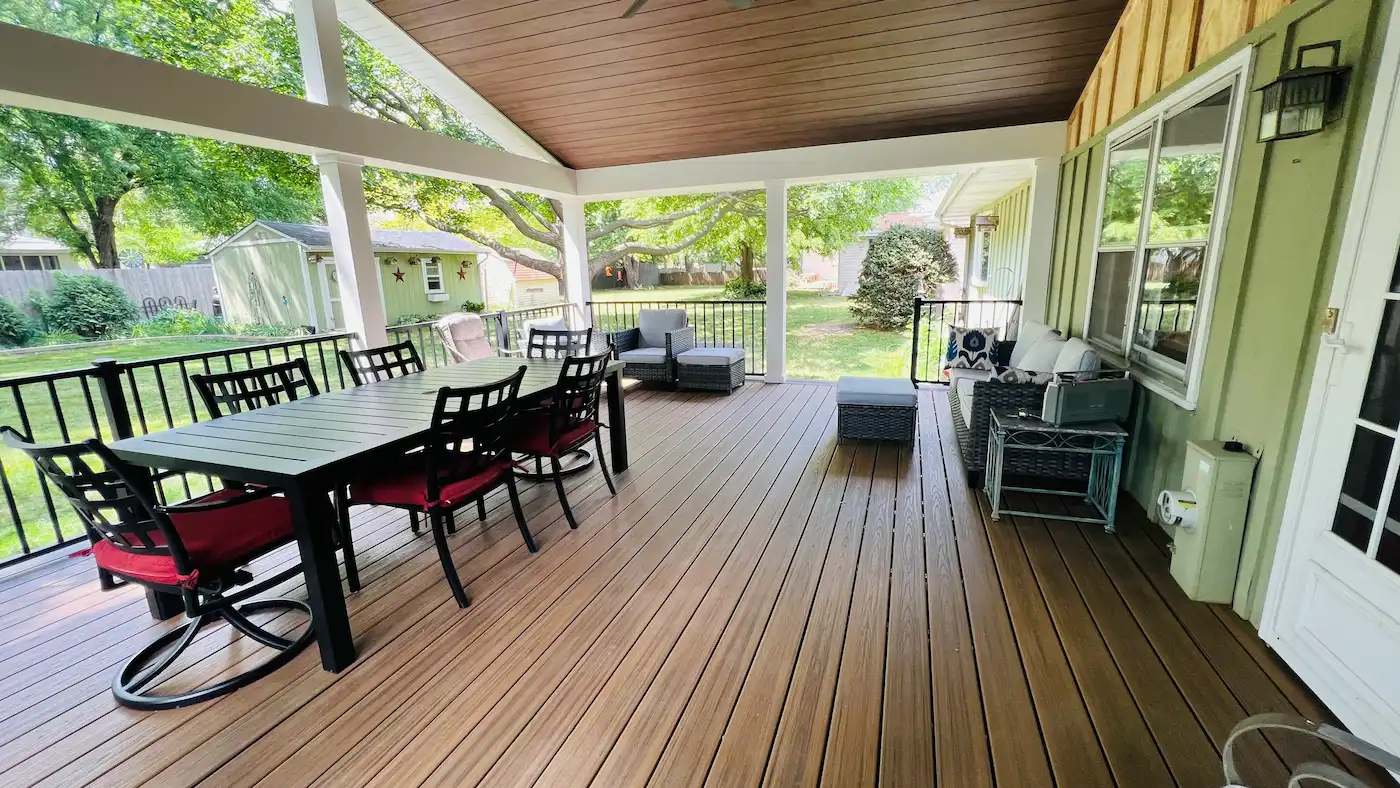 Covered Trex composite deck with an outdoor dining and seating area in Naperville, IL.