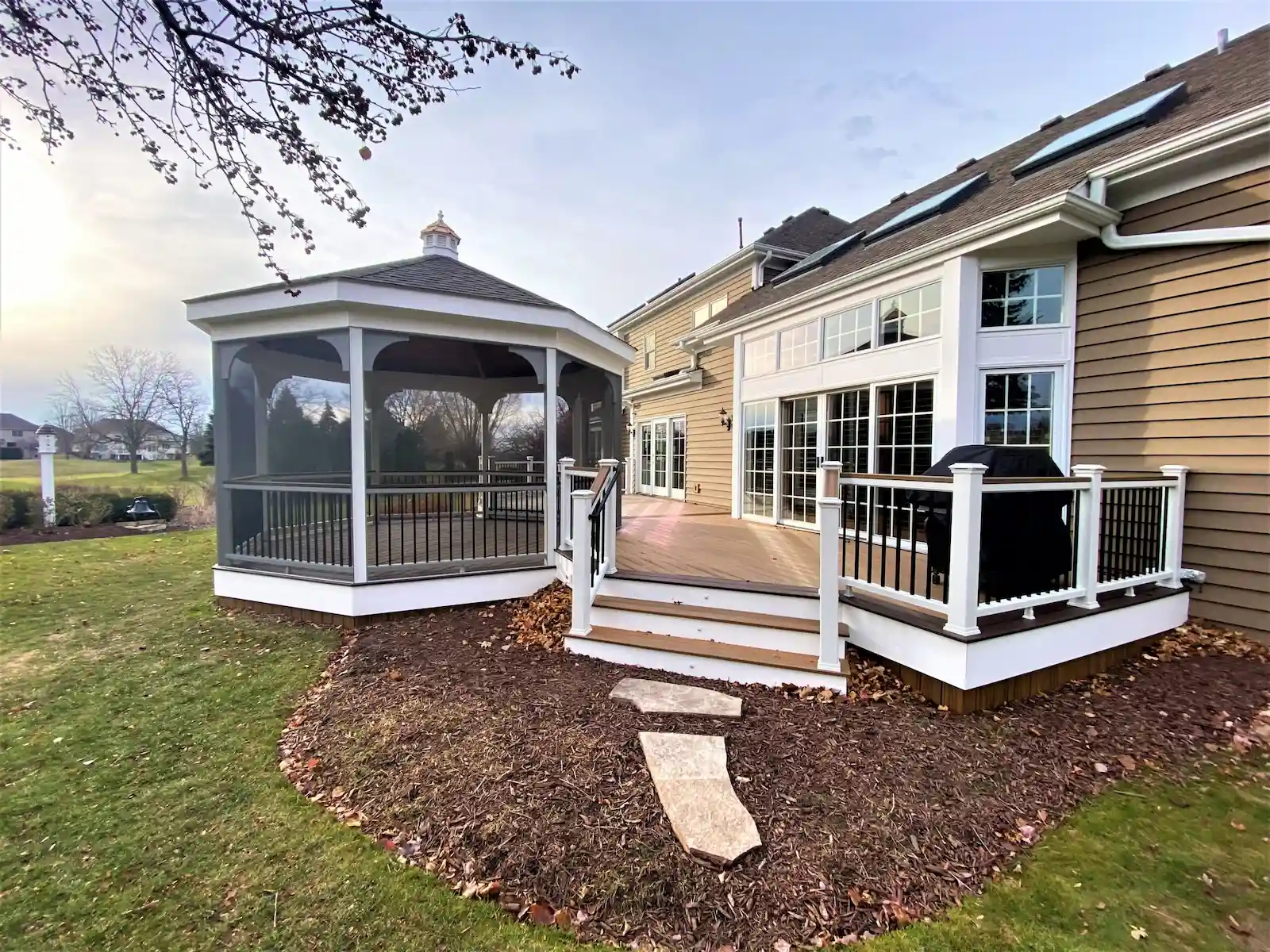 residential-trex-deck-with-screen-gazebo-installation composite deck integrated with a screened gazebo