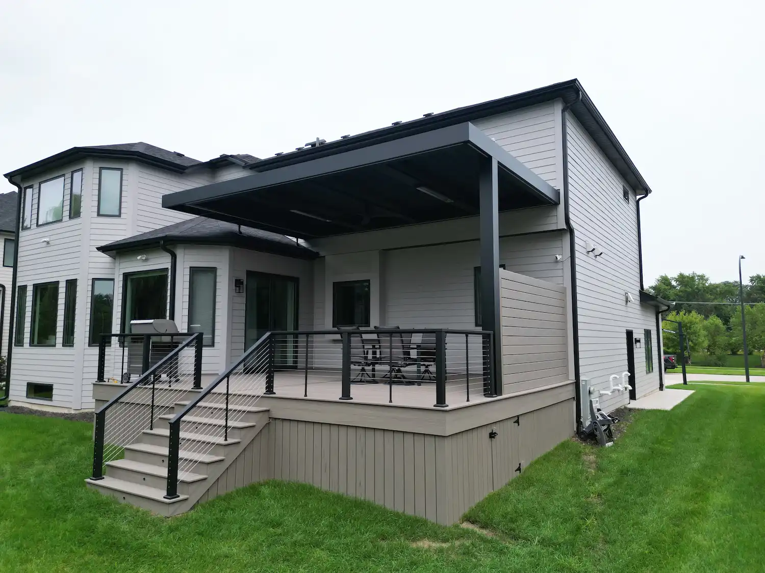 Smart louvered roof pergola installed on top of Trex Lineage composite decking in Naperville, IL.