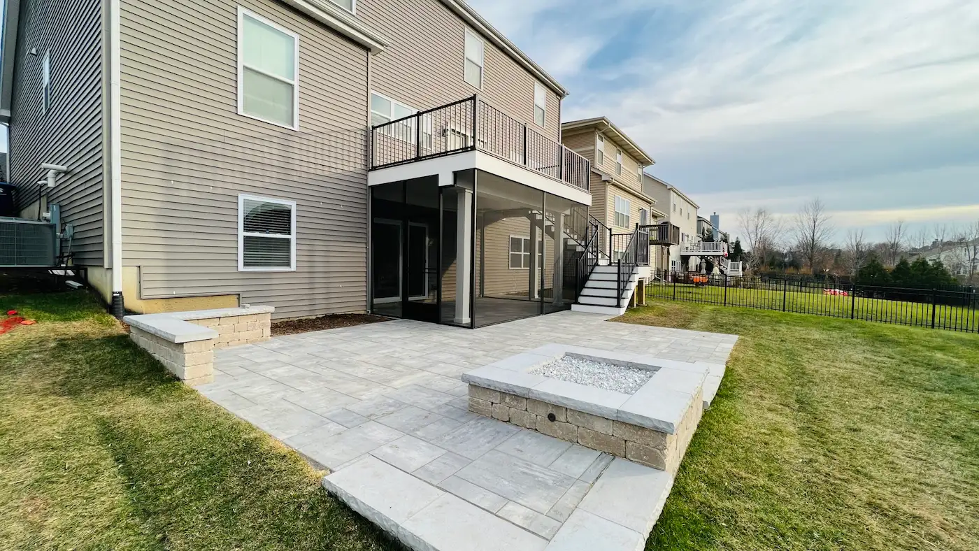 Second-story Trex composite deck with a staircase and a screened-in under-deck patio in Shorewood, IL