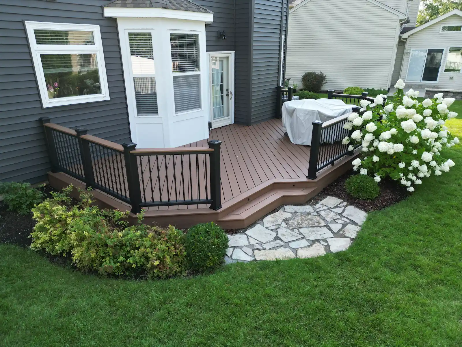 trex-deck-installation-naperville-illinois Newly installed Trex composite deck in Naperville, Illinois by a deck contractor.